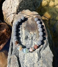 0003 - Gray lava with petrified wood & aquatine calcite