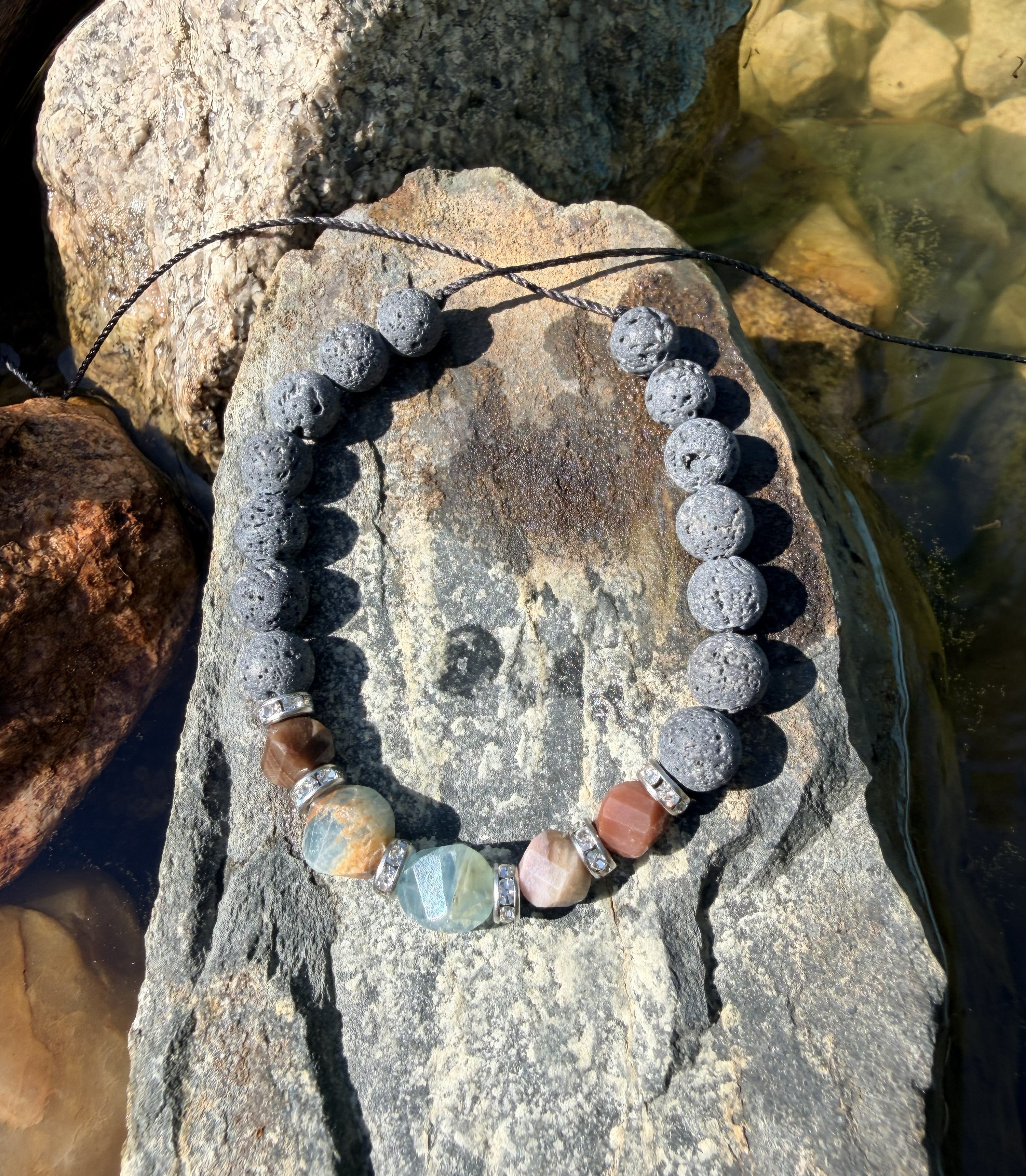 0003 - Gray lava with petrified wood & aquatine calcite