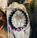 0005 - Black lava with rainbow cats eye & roughcut ruby