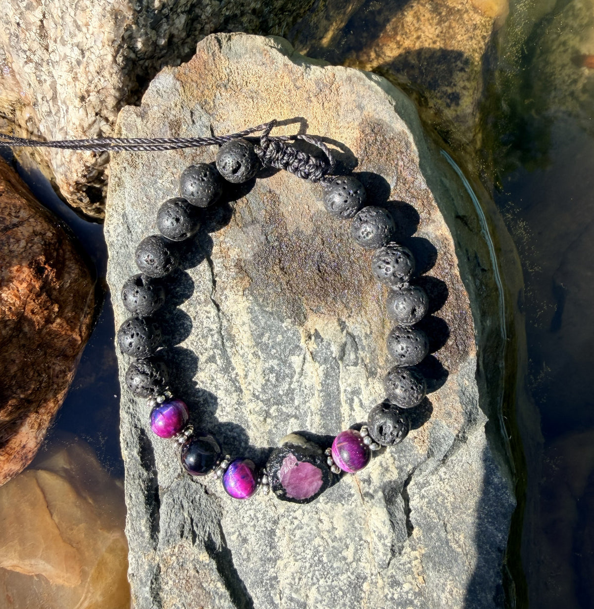 0005 - Black lava with rainbow cats eye & roughcut ruby