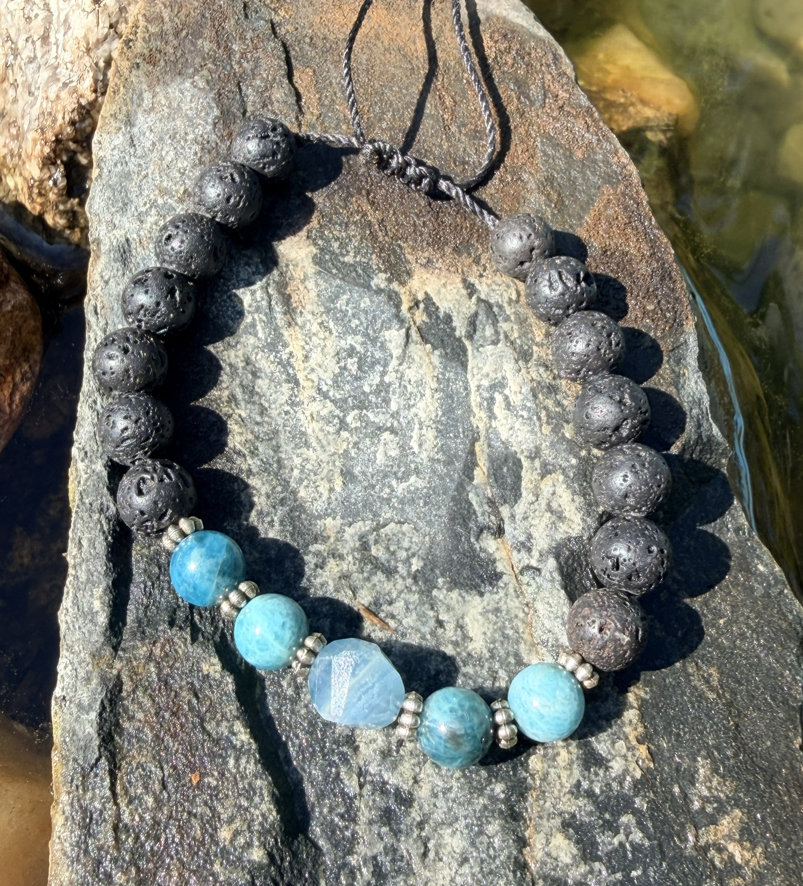 0020 - Black lava with tourquoise & aquatine calcite