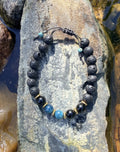 0038 - Black lava with black obsidian & blue apatite