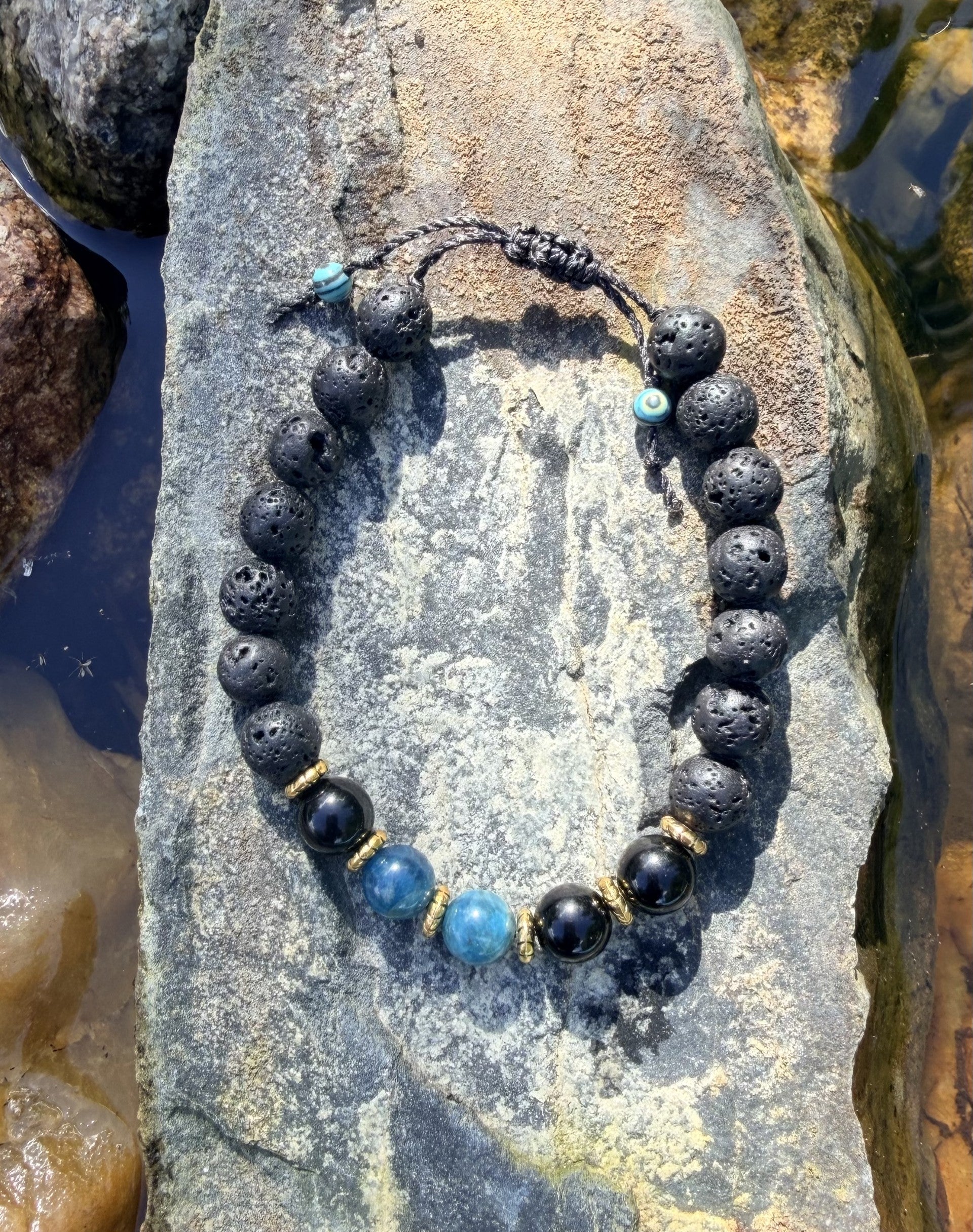 0038 - Black lava with black obsidian & blue apatite
