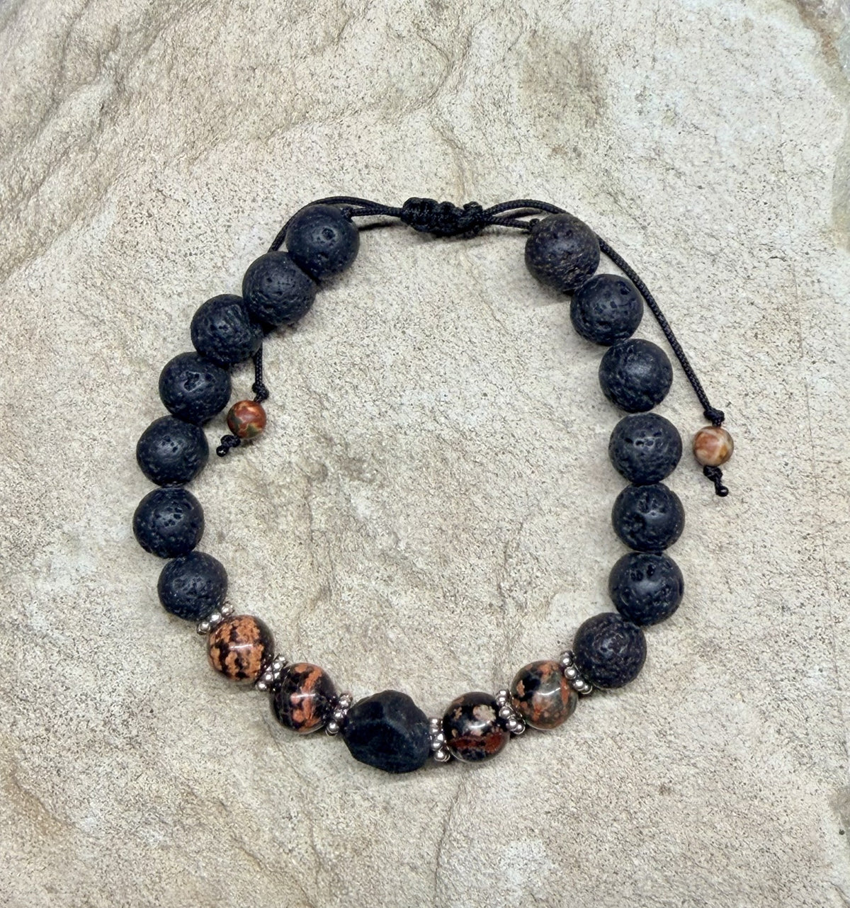 0046 - Black lava with red snowflake obsidian & roughcut spinel