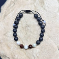 0050 - Black lava with garnet & pearl