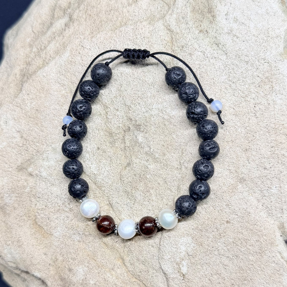 0050 - Black lava with garnet & pearl