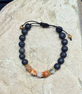 0059 - Black lava with petrified wood & fossilized coral